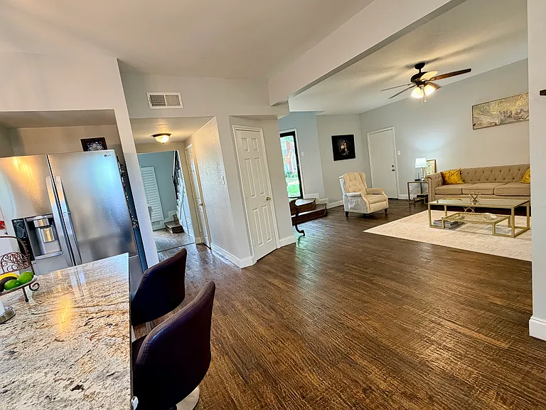 view of entrance door and living room from kitchen
