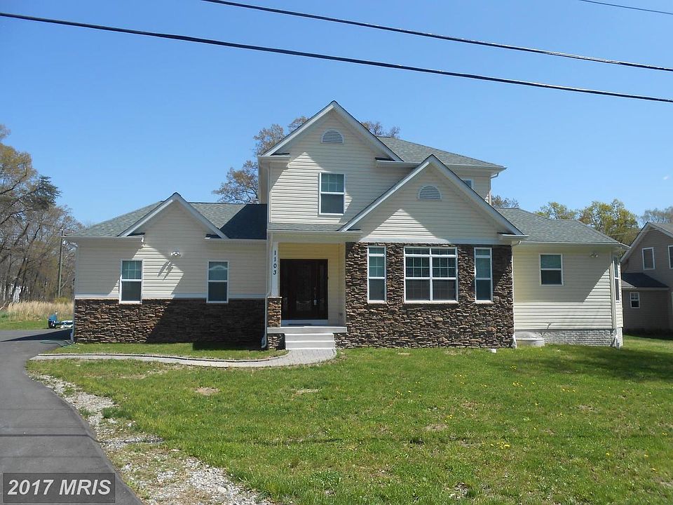 Stone front with covered entry way.