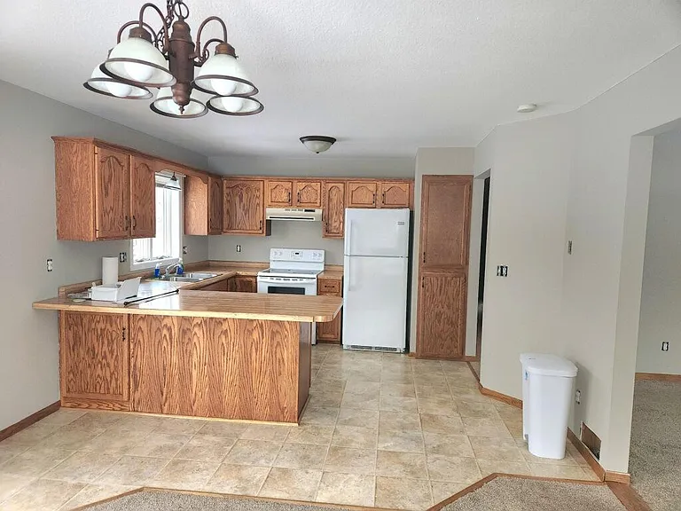 Kitchen with refrigerator, stove microwave, and dishwasher.