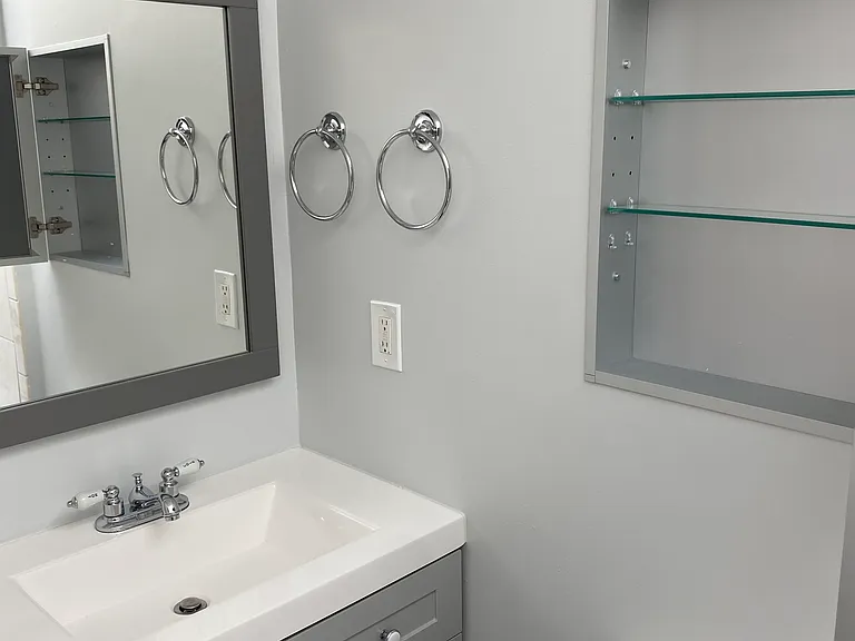 bathroom with new vanity, sink, fixtures, hardware, and mirror/medicine cabinet