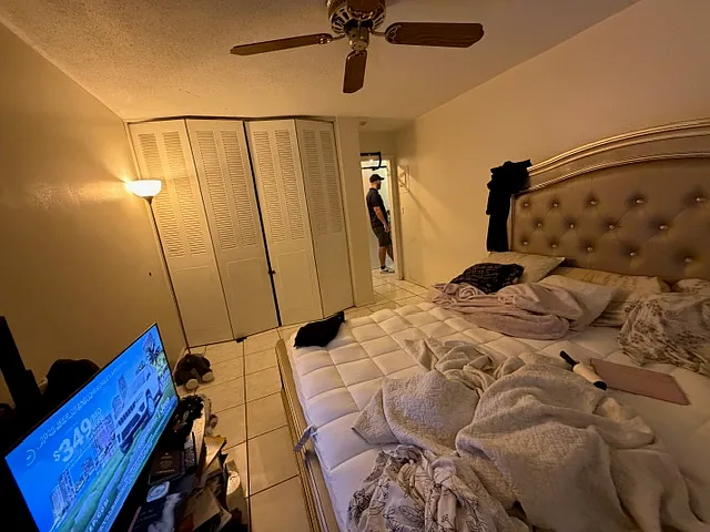 Bedroom with Closet and Ceiling Fan. A Walk-in closet just outside door in Hall.