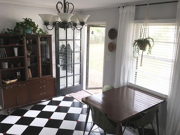 large kitchen with backdoor to patio