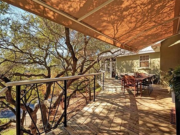 Custom retractable awnings provide covered outdoor living spaces