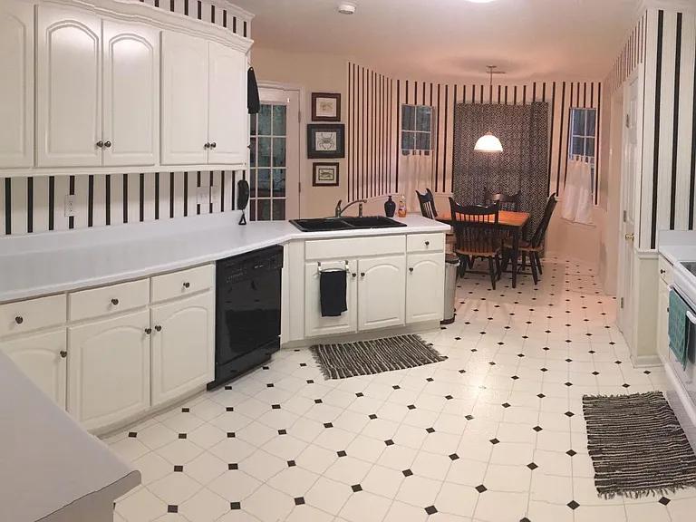 Kitchen showing door to screened porch