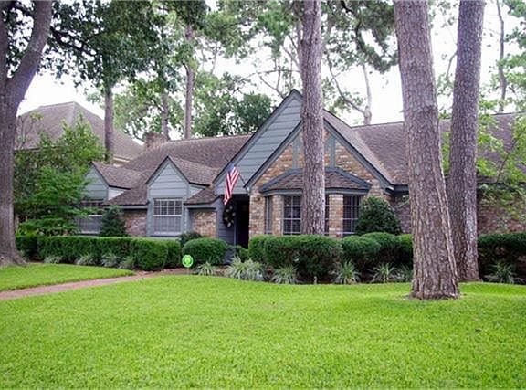 Features massive trees in front and back