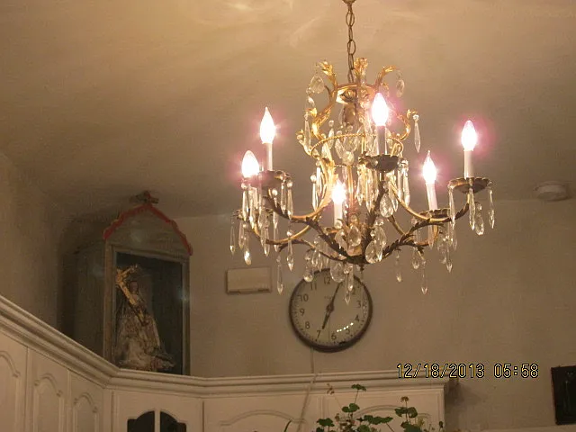 Beautiful antique chandelier in kitchen