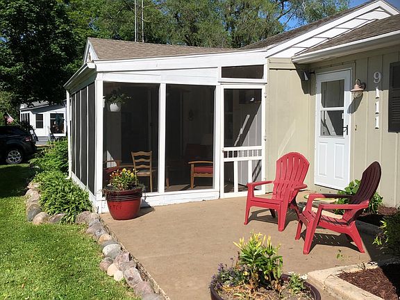 Front yard patio and screened in porch.