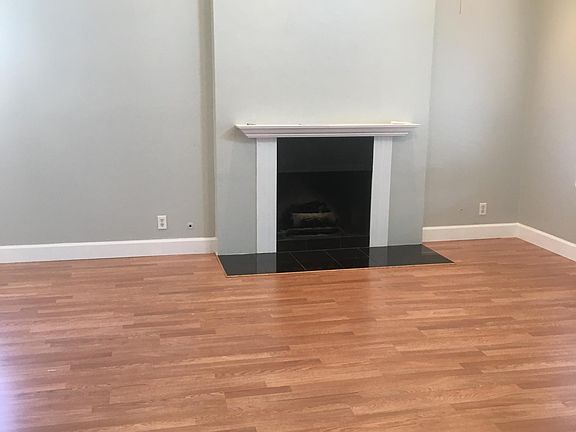 Living room with vaulted ceilings and tons of natural light, recessed lighting, and ceiling fan
