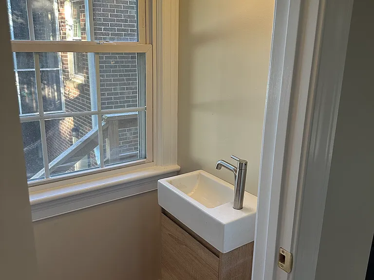 Half bath on first floor with lots of natural light