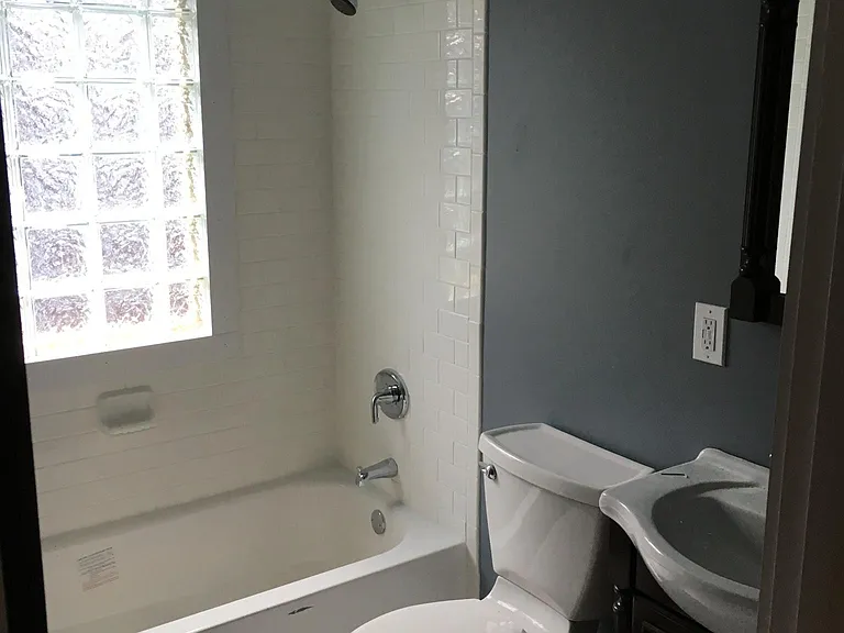 Brand new tile floor, subway tile and privacy glass block wi