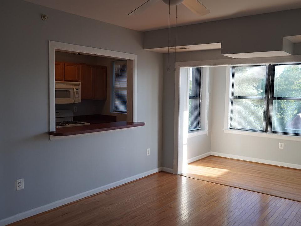 View from the entry, main room with view of kitchen and sun room.