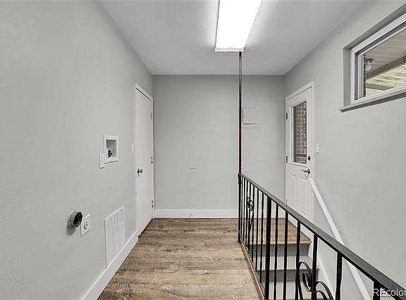 Hallway to garage, patio and to lower level