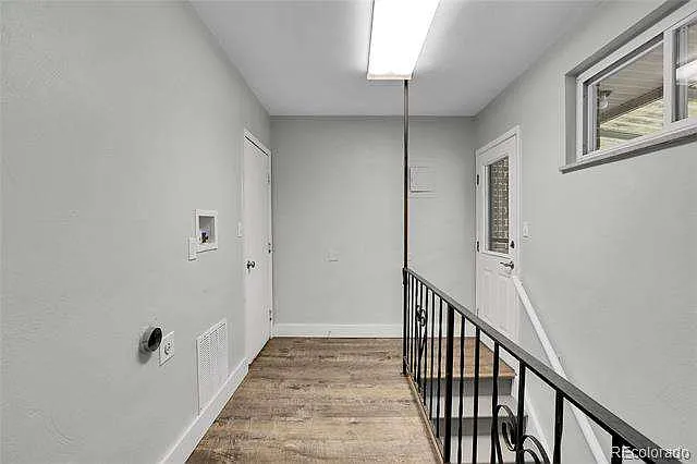 Hallway to garage, patio and to lower level