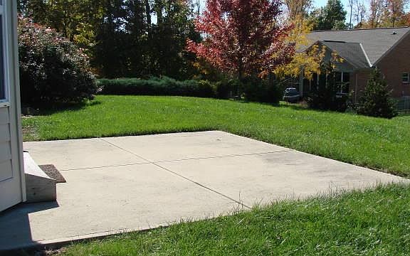Patio with view of fenced back yard.