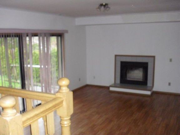 At the back of the home, you will enjoy your fireplace in the family room, with access to the back y
