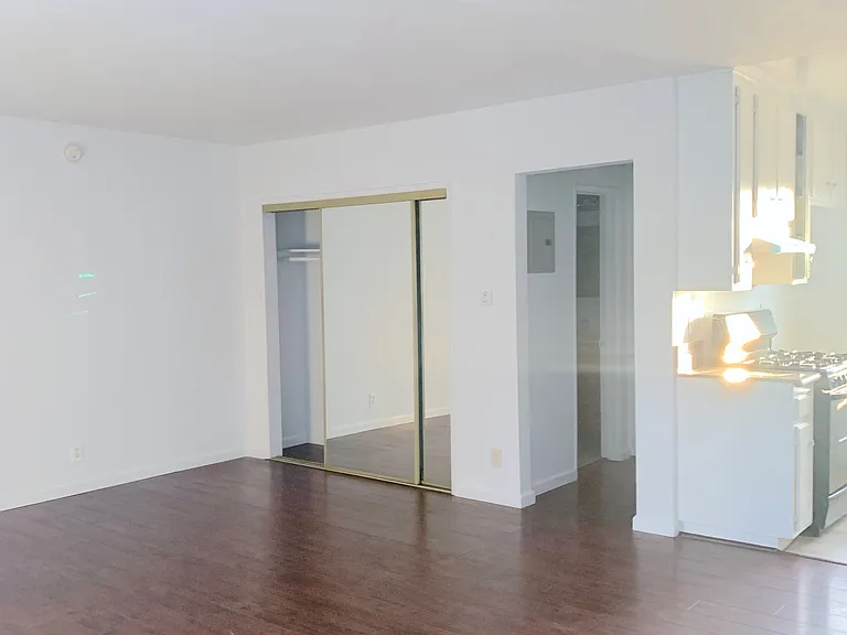 This studio has natural light flooding into the unit from both sides