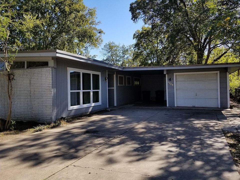 Front of house carport and garage.