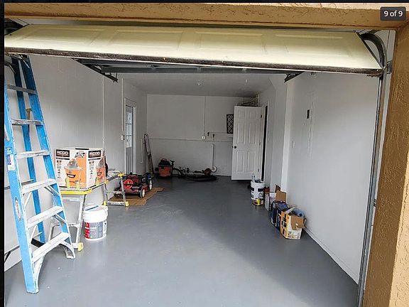 One car garage, walls and floor repainted