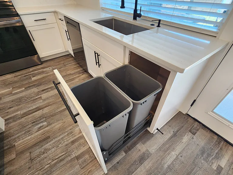 Dual pull out trash cans
