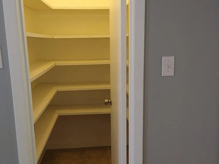 Spacious walk in pantry.