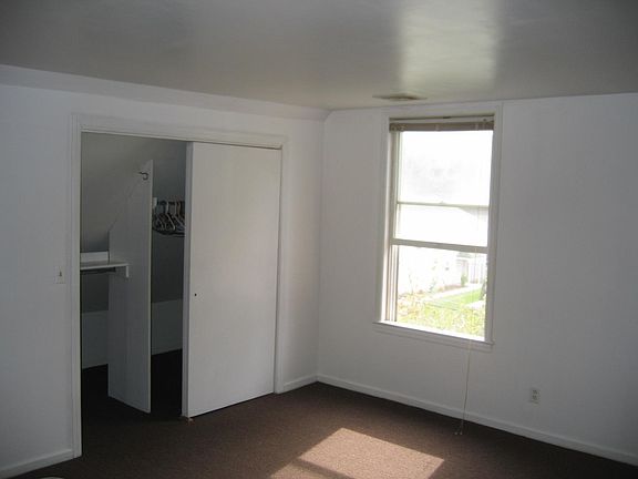 bed room with large closet, including side storage space