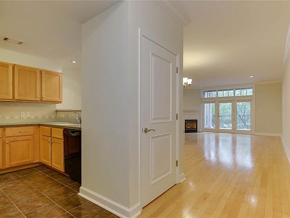 Walk in past your kitchen and onto the beautiful livingroom with gas fireplace