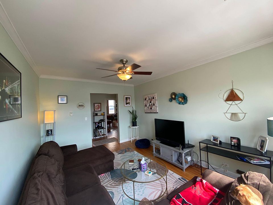 Living room w/ view of entry to second bedroom/office across the foyer (previous listing)
