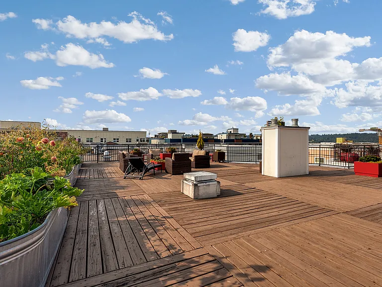 Rooftop deck with community p-patch style gardening beds