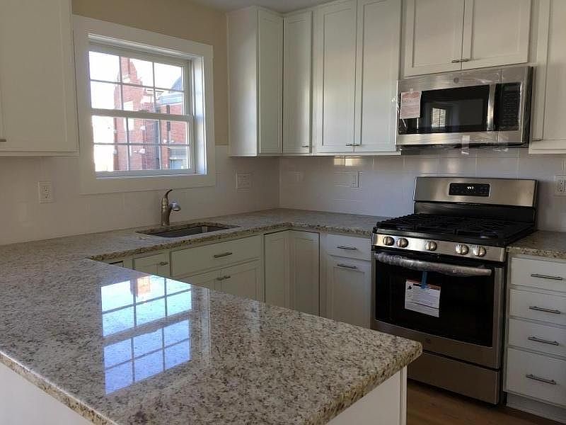 Kitchen w/ Stainless steel appliances, gas range stove