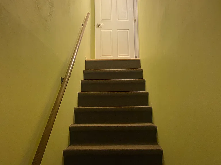 Stairs from basement into first floor