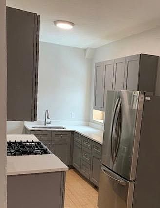 New kitchen with gas range.