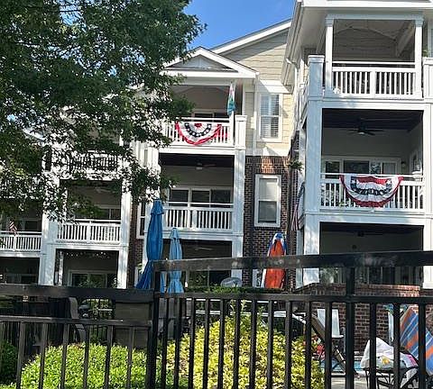 Condo Exterior view. Condo available is the second floor unit right over the pool with the water view straight ahead.