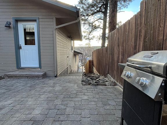 patio, front door and walkway to driveway