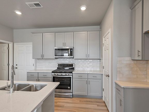 The open-concept kitchen spills into the dining room allowing for an open feel.