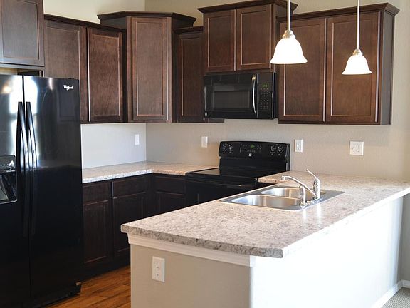 Kitchen with newer appliances and breakfast bar