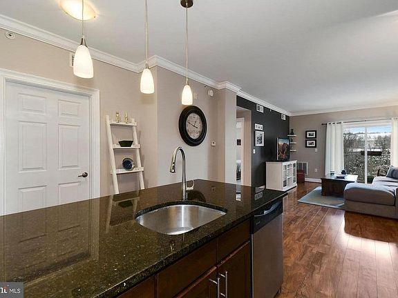 This dark wall in the back corner is no longer dark - it is the same color as the rest of the walls.