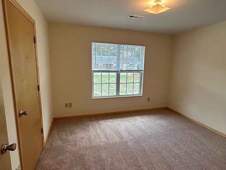 Secondary bedroom with closet