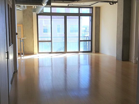 AS you walk in the front door - view of living, dining and balcony
