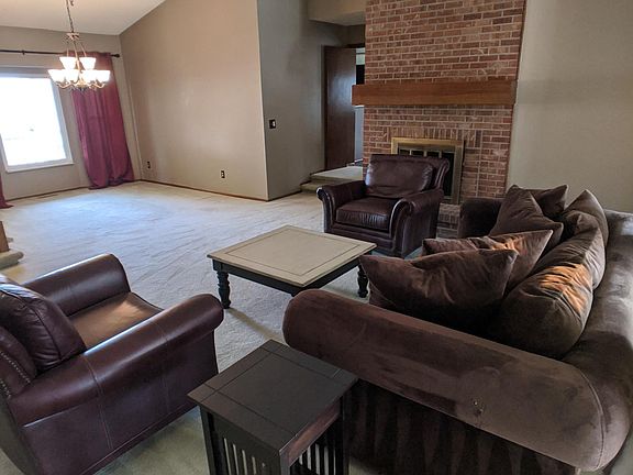 The living room is adjacent to the formal dining room.