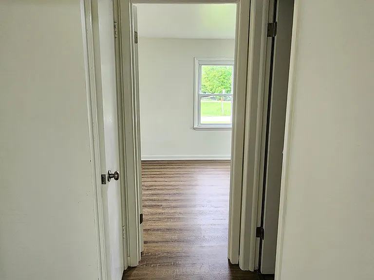 End of hall. Bathroom between bedroom 2 and 3