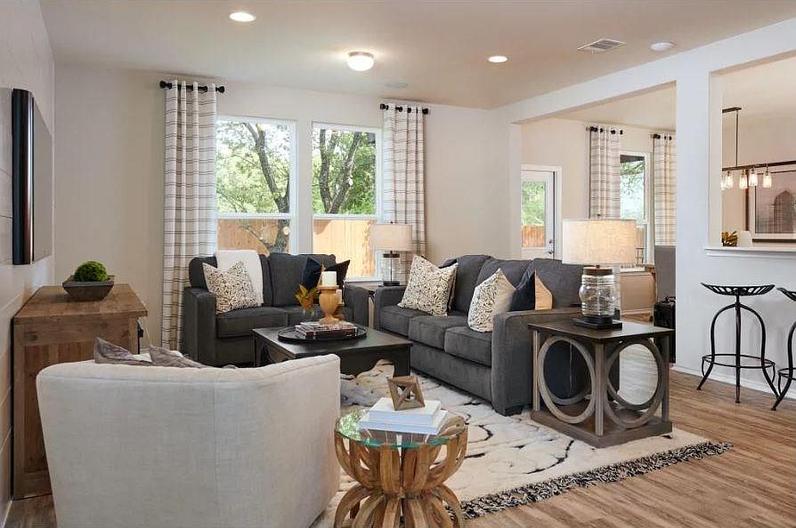 Living room. Photo of a model home with similar layout.