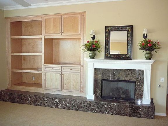 Gas remote control custom mantel fireplace and built in media wall. 