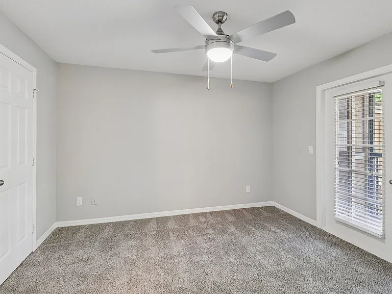 Comfortable bedroom with natural light and direct patio access
