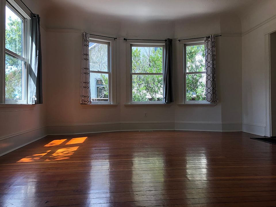 Living room with bay windows
