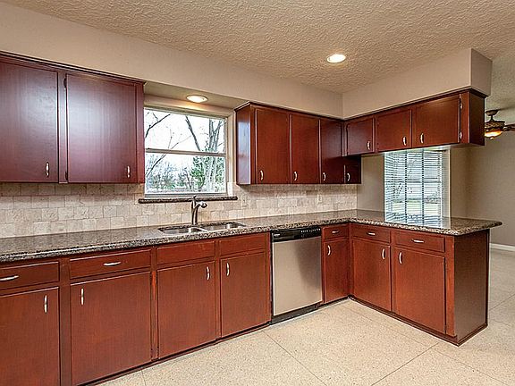 UDPATED KITCHEN FEATURING GRANITE TOPS & TUMBLED BACK SPLASH ~