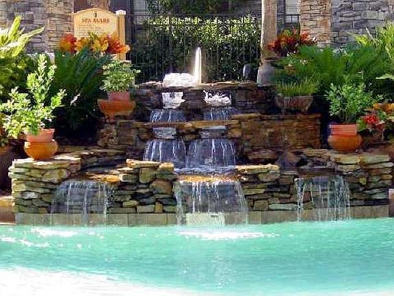 Resort pool with hot tub and waterfall