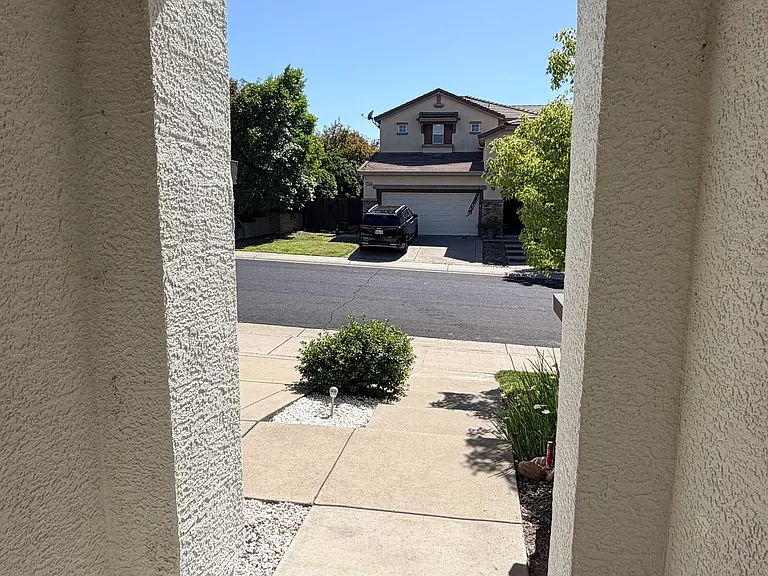 Waving at the neighbors from the front door