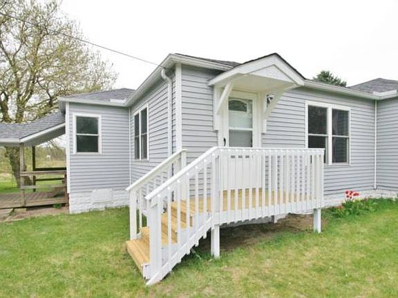 A very welcoming new front porch for your guests to enter the home.