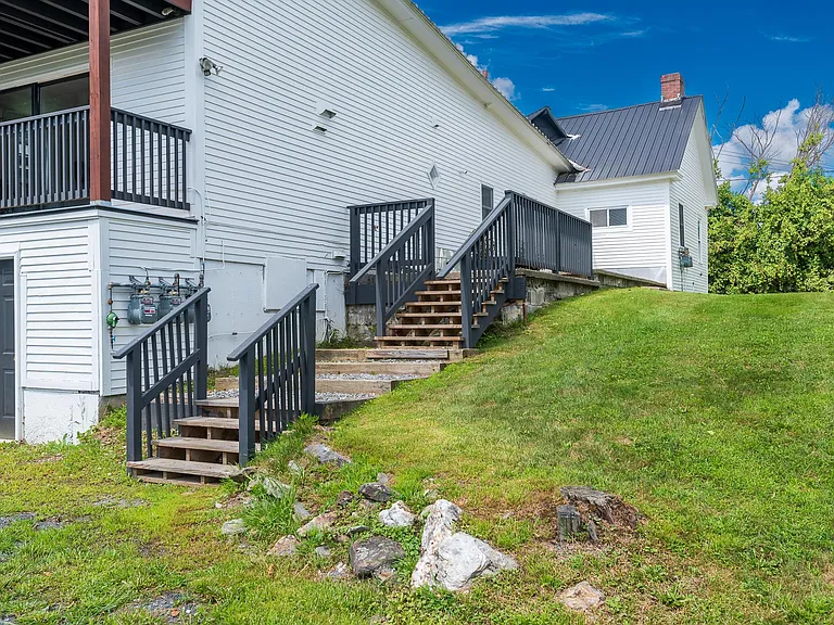 Steps from parking area in rear of building