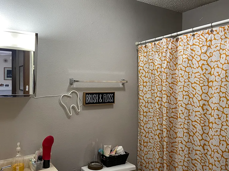 One of 2 full bathrooms tub and shower in both